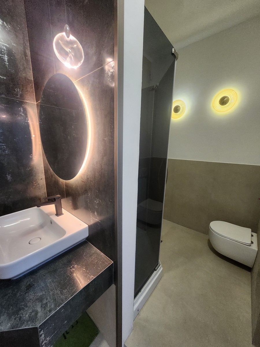 Master bathroom mirror and lighting fixtures