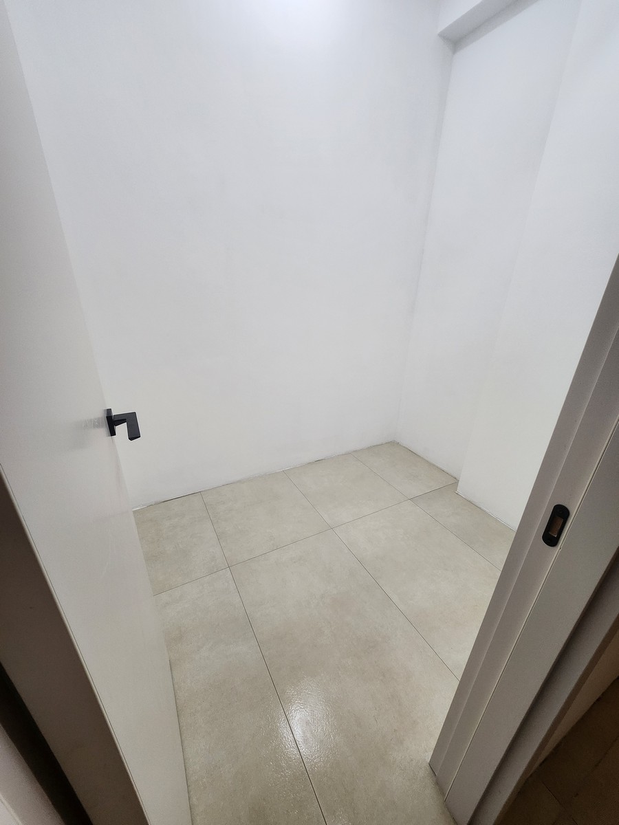 Hallway with marble flooring and art