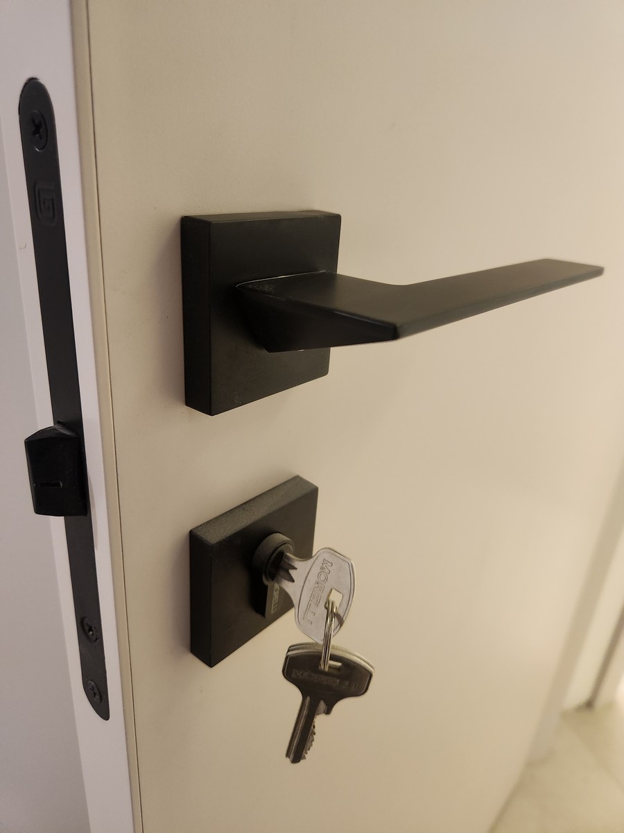 Master bedroom with king-size bed, elegant bedding, and ambient lighting