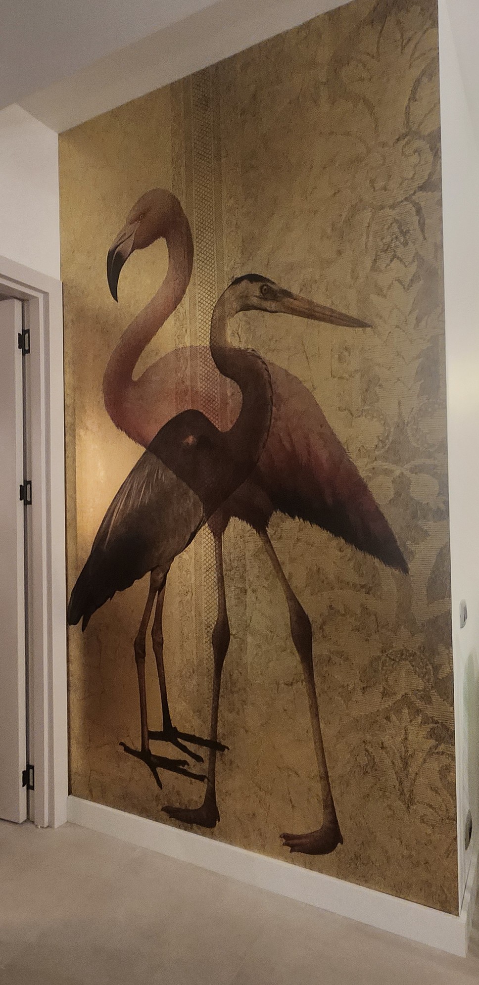 Home office space with desk, ergonomic chair, and built-in bookshelves